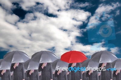 Leader Holding Red Umbrella For Show Different Think Stock Photo