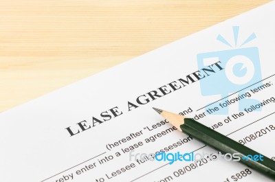 Lease Agreement Contract Document And Pencil At Bottom Right Corner Stock Photo