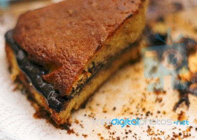 Leftover Cake With Chocolate Cream And Crumbs Stock Photo