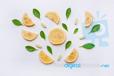 Lemon, Leaves And Vitamin C. On White Stock Photo Lemon, Leaves And Vitamin C. On White Stock Photo