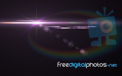 Lens Flare Shot In Studio Over Black Background. Easy To Add As Stock Image