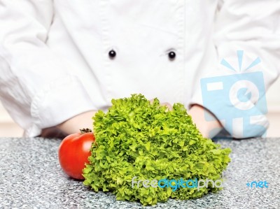 Lettuce And Tomato In Front Of The Chefs Stock Photo