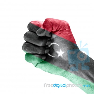 Libya Flag On Clenched Fist Hand Stock Photo