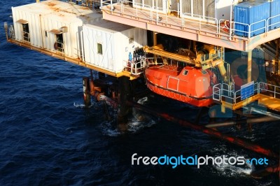 Life Boat Or Survival Craft At Muster Station Of Oil And Gas Drilling Rig Stock Photo