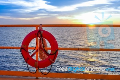 Life Buoy Hanging On The Handrail Of Offshore Platform Stock Photo