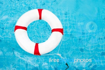 Life Ring At The Swimming Pool. Life Ring On Water. Life Ring On… Stock Photo