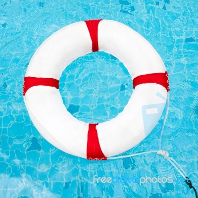 Life Ring At The Swimming Pool. Life Ring On Water. Life Ring On… Stock Photo