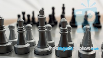 Light And Dark Wooden Chess Pieces On Chess Table Stock Photo