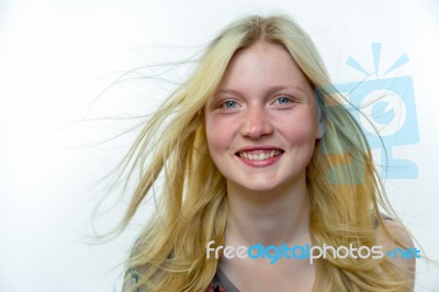 Light Blonde Girl With Hair In Wind Stock Photo