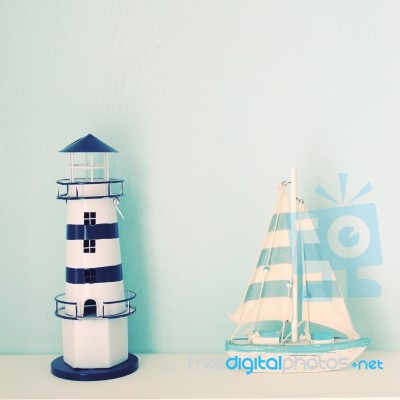 Lighthouse And Ship Model For Decorated Stock Photo