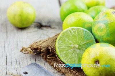 Lime Cut On A Wooden Stock Photo