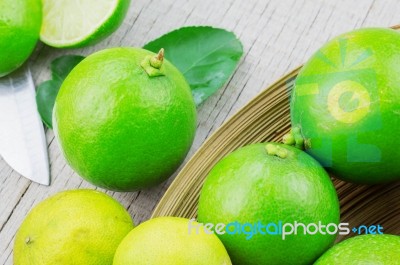 Lime On Tray And Wooden Stock Photo