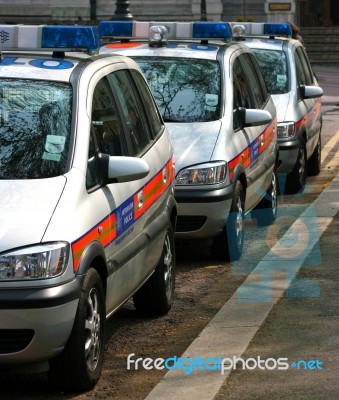 Line Of Police Cars In England UK Stock Photo