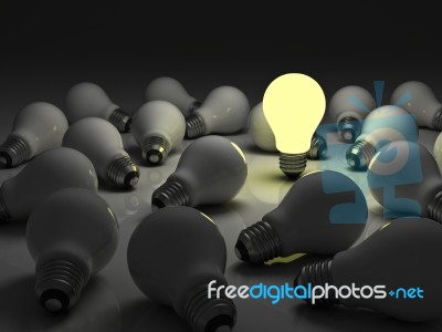 Lit Bulb Among Unlit Stock Image