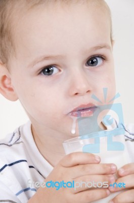 Little Boy Drinking Milk Stock Photo
