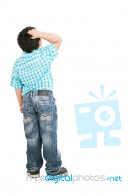 Little Boy Scratching His Head Stock Photo