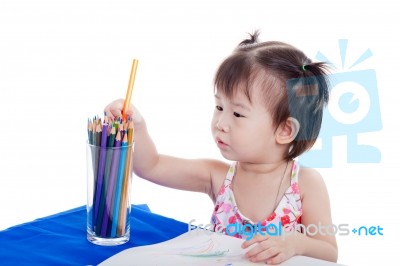 Little Girl Choosing Colour Pencil For Draw Picture Stock Photo
