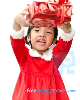 Little Girl Dressed As Santa Claus Stock Photo