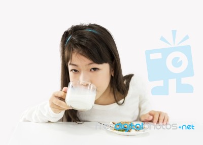 Little Girl Drinking Milk Stock Photo