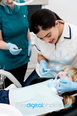 Little Girl Examined By Dentist Stock Photo