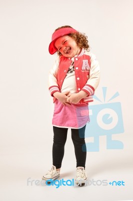 Little Girl Fashion Model With Red Cap Stock Photo