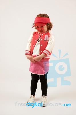 Little Girl Fashion Model With Red Cap Stock Photo