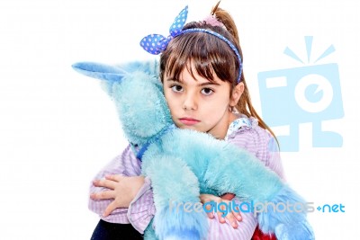 Little Girl Holding Blue Unicorn Toy Isolated On White Stock Photo
