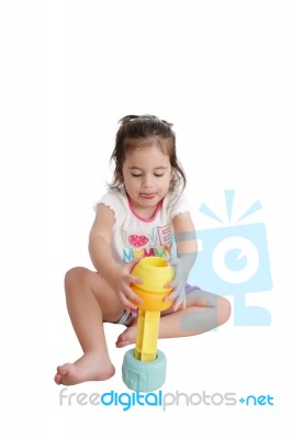 Little Girl Playing With Toys Stock Photo