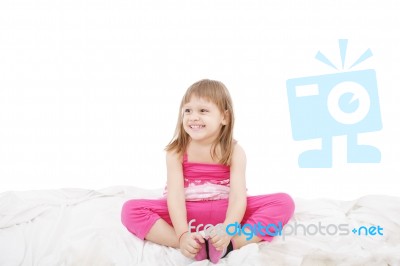 Little Girl Sitting On Floor Stock Photo