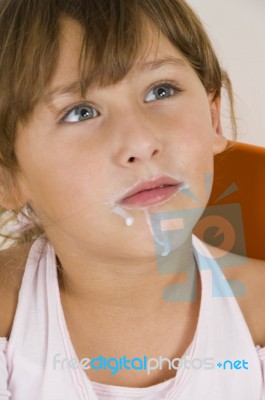 Little Girl With Milk Mustache  Looking Upward Stock Photo