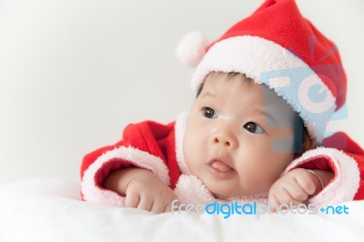 Little Girl With Santa Costume Stock Photo