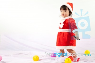 Little Girl With Santa Costume Stock Photo