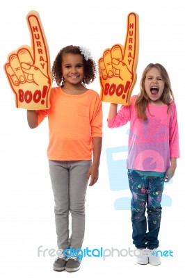 Little Girls Raises Arms With Foam Finger Stock Photo