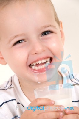 Little Laughing Boy Drinking Milk Stock Photo