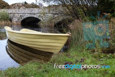 Llanberis, Wales/uk - October 7 : Yellow Rowing Boat On A River Stock Photo