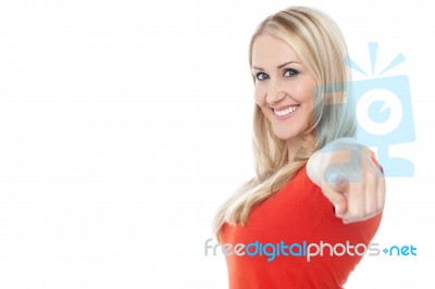 Lovely Casual Woman Pointing Towards Camera Stock Photo