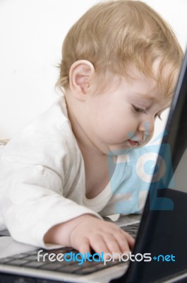 Lovely Curious Child With Laptop Stock Photo