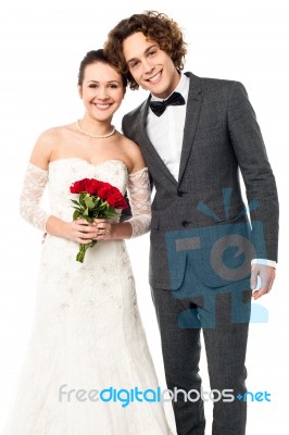 Lovely Newlywed Couple Posing For A Portrait Stock Photo