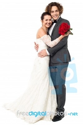 Lovely Young Married Couple Embracing Warmly Stock Photo