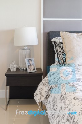 Luxury Bedroom With White Lamp On Wooden Side Table Stock Photo