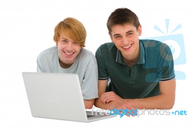 Lying Teenage Boys With Laptop Stock Photo