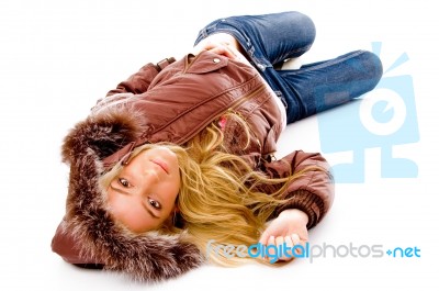 Lying young lady wearing hood Stock Photo