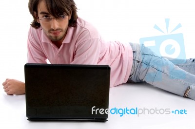 Lying Young Man With Laptop Stock Photo