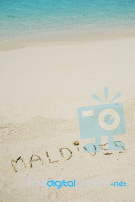 Maldives Written In A Sandy Tropical Beach Stock Photo