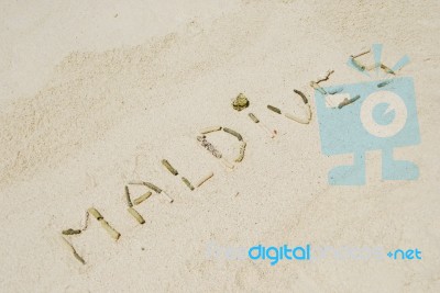 Maldives Written In A Sandy Tropical Beach Stock Photo