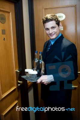Male Butler Holding Beverages Stock Photo