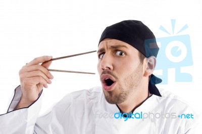 Male Chef Holding Chopstick Stock Photo
