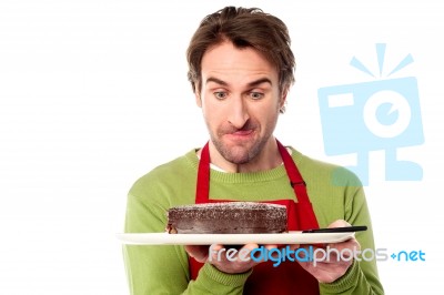 Male Chef Holding Yummy Chocolate Cake Stock Photo