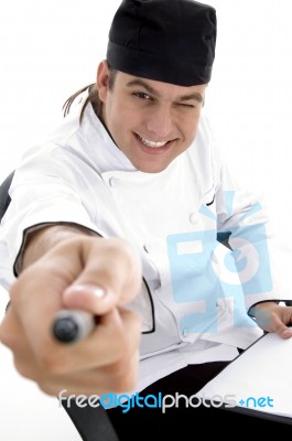 Male Chef Pointing with pen Stock Photo