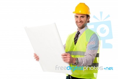 Male Construction Worker Holding Blueprint Stock Photo